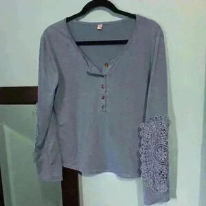 sky blue top with crocheted sleeves, size M? Xuan brand
